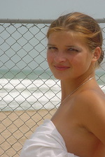 Busty teen girl on the beach 02