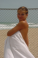 Busty teen girl on the beach 06