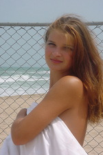 Busty teen girl on the beach 07